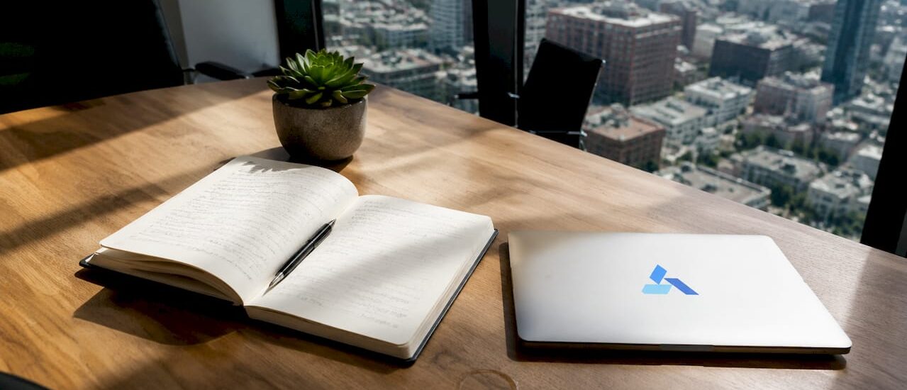 Business analytics workspace with Blue Prysm branded laptop