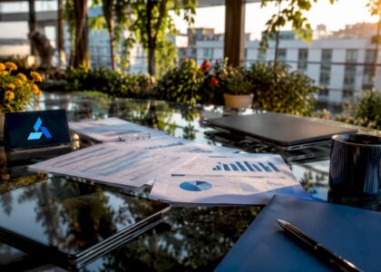 Business analyst workspace with Blue Prysm logo and data materials