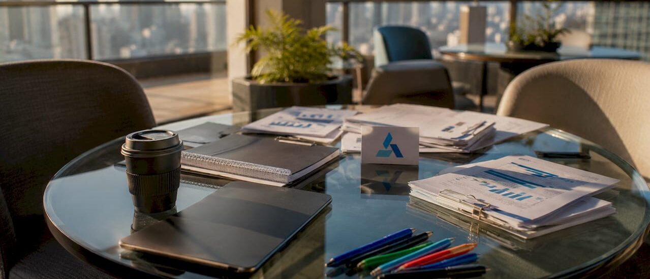 Empty boardroom with Blue Prysm logo and strategic planning materials