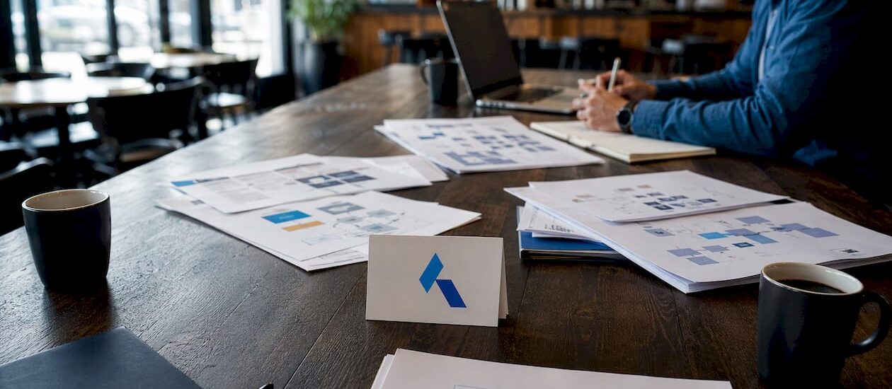 conference table with Blue Prysm logo and data security materials