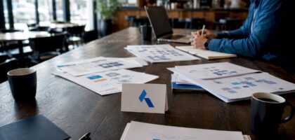 conference table with Blue Prysm logo and data security materials