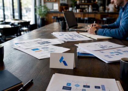 conference table with Blue Prysm logo and data security materials