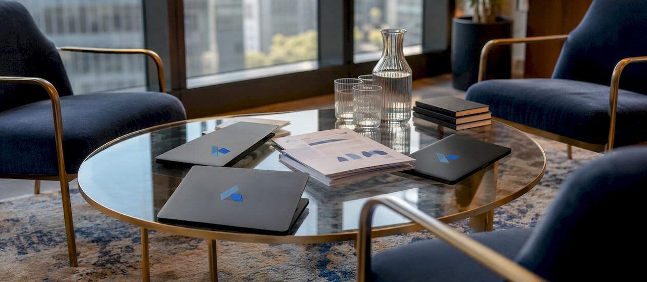 Conference table with sales strategy materials and Blue Prysm logos
