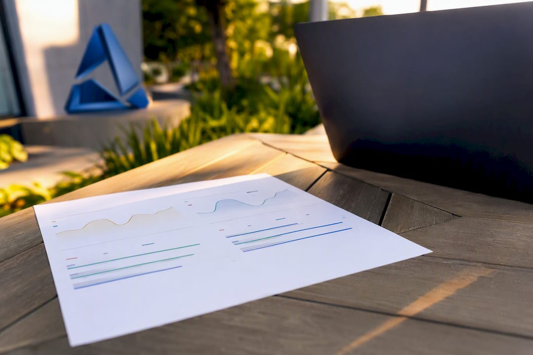 Printed sentiment trend and intensity charts on desk
