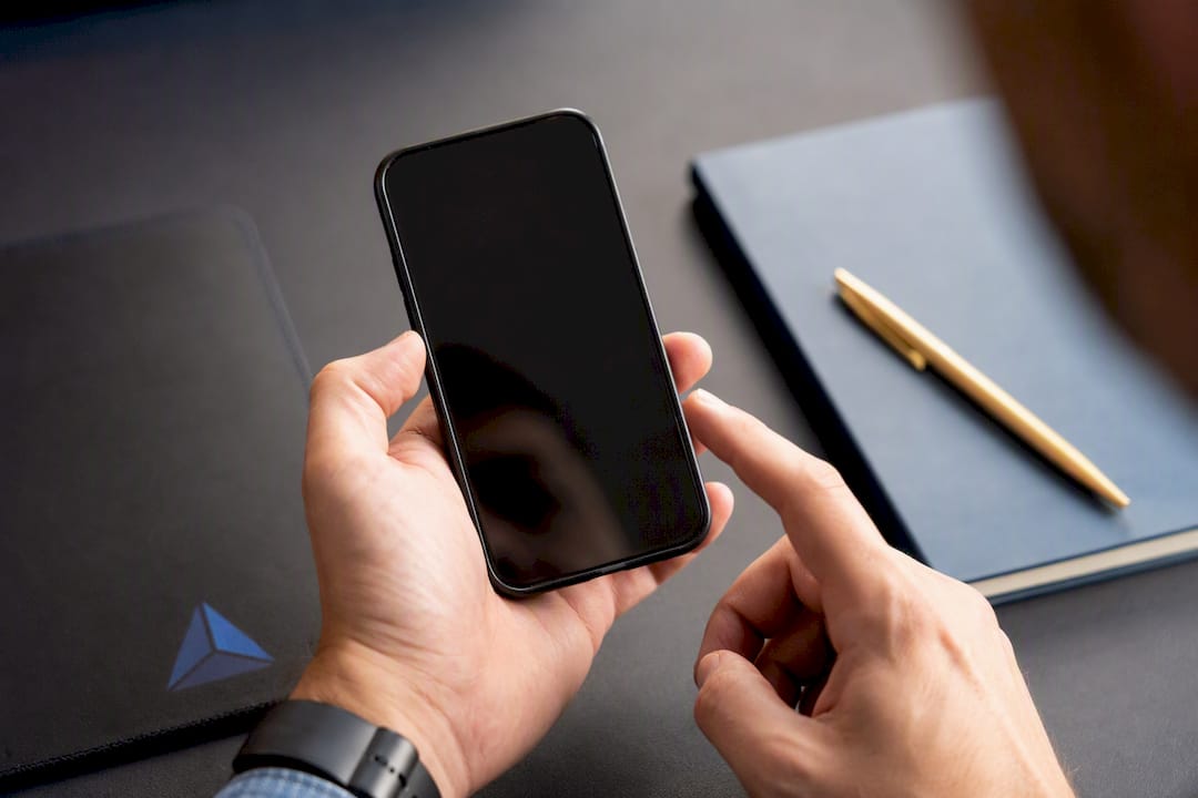 Hands preparing landing page test on device