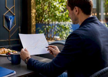 Hands analyzing market trend graph