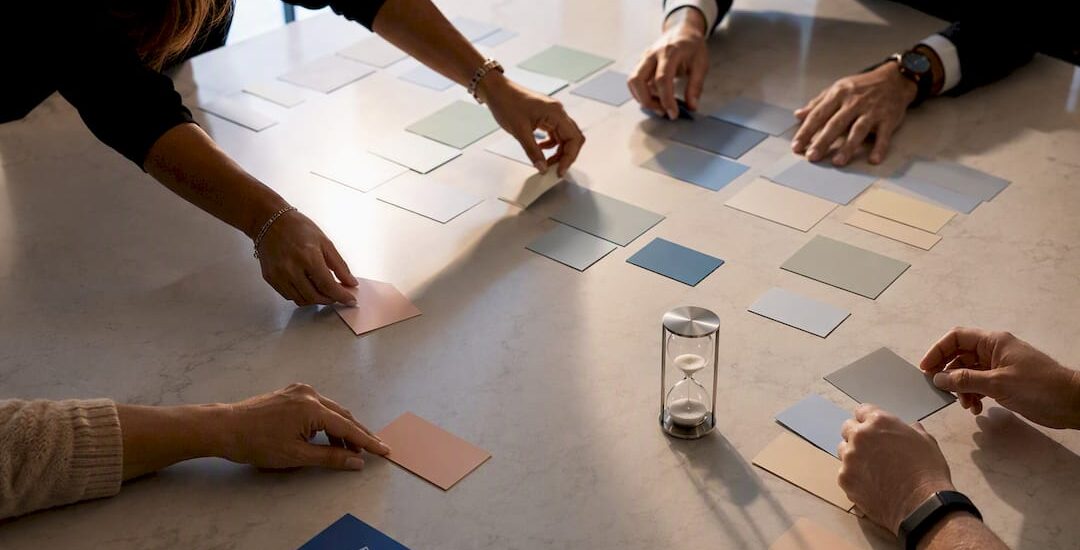 Hands arranging strategic roadmap initiatives